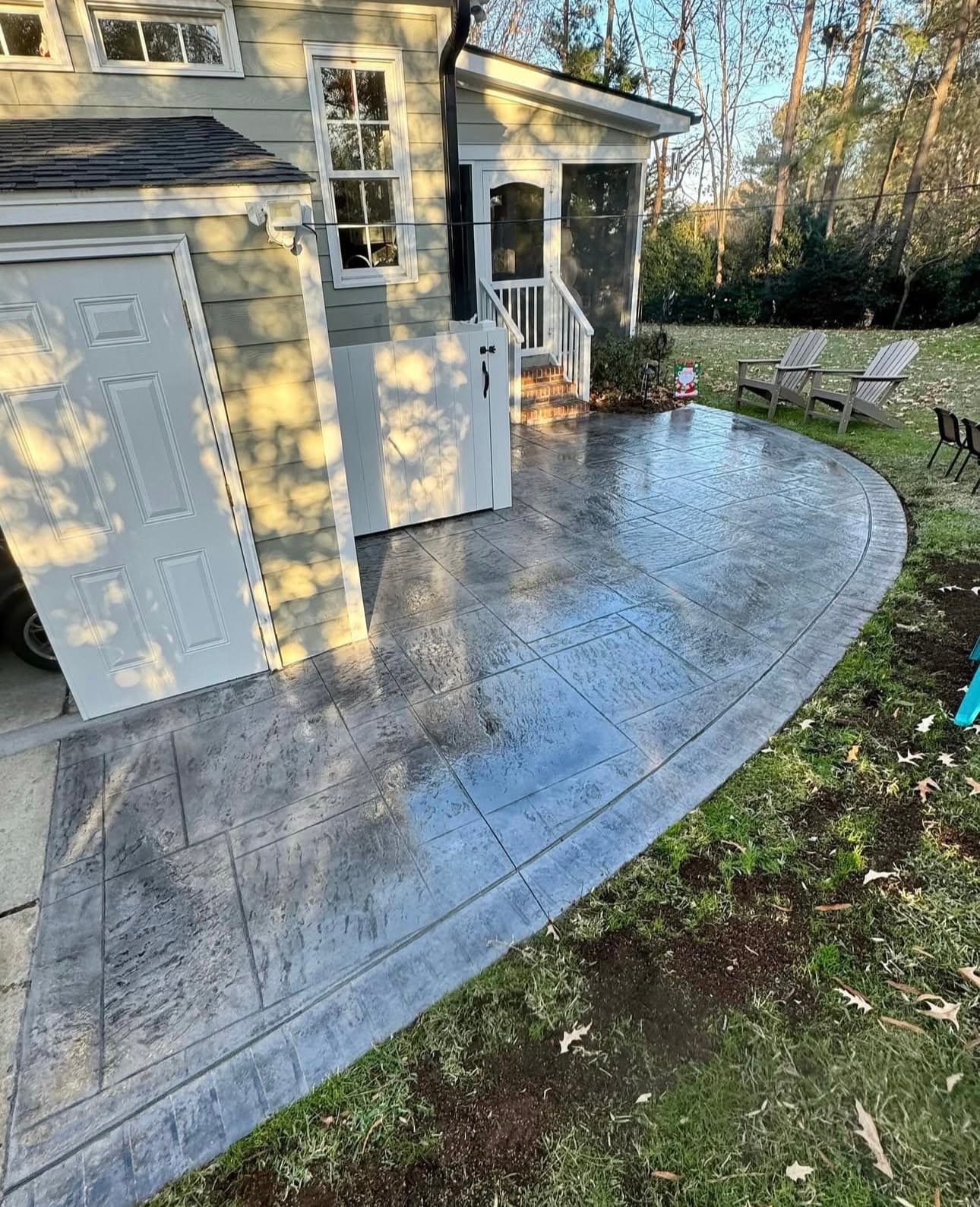 Curved stamped concrete patio at house entrance