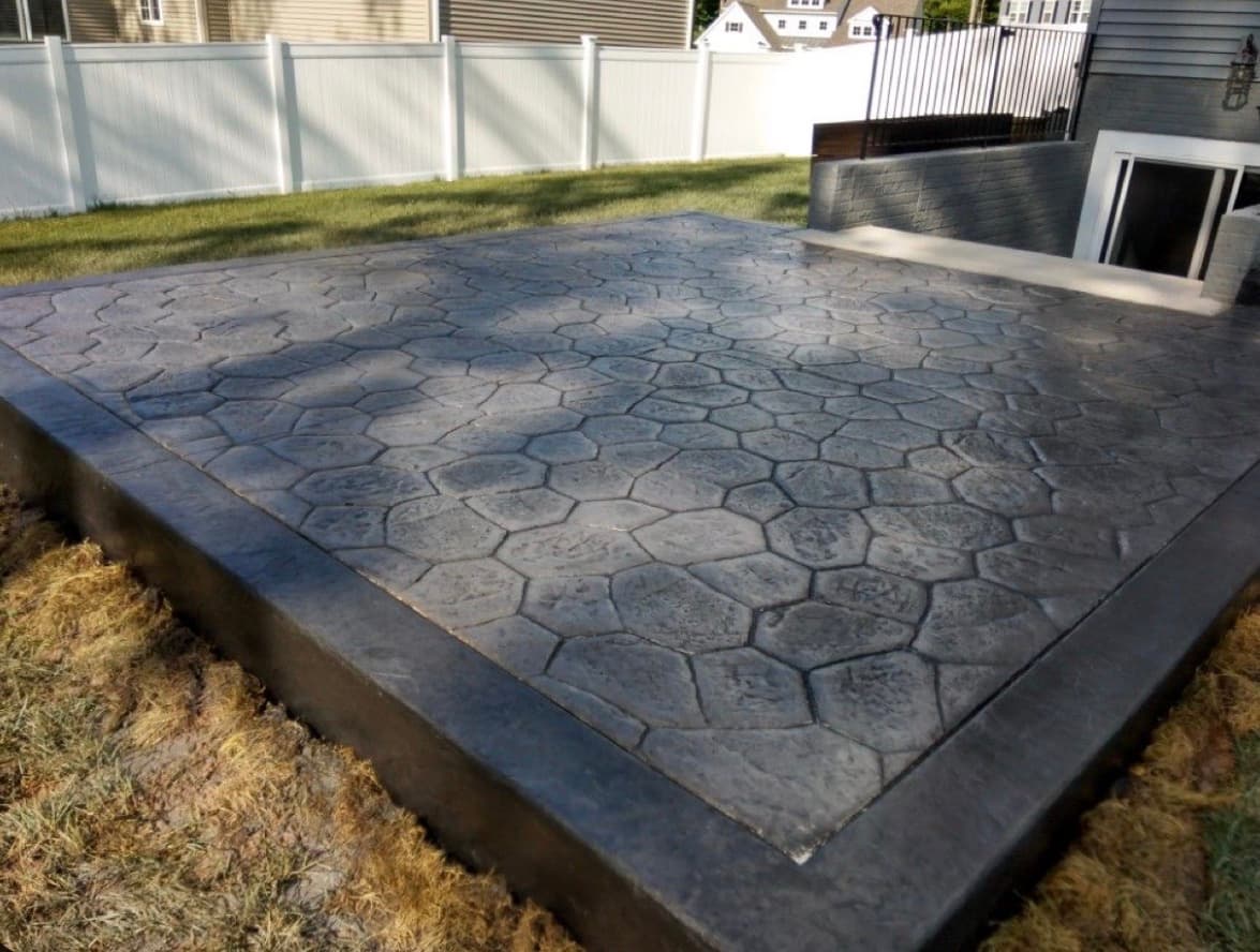 Dark hexagonal stamped concrete patio